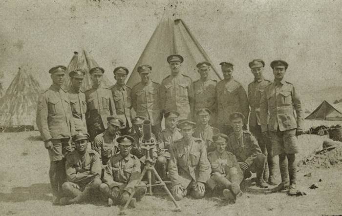 Stokes trench mortar with team. Group of soldiers posing with a trench mortar, Salonika, taken by Capt Philip Rolls Asprey, whilst serving with 2nd Bn The Buffs (East Kent Regiment), nd, 1916 © National Army Museum.