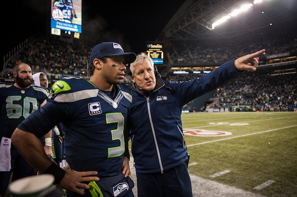 Russell Wilson listens as Pete Carroll gives instructions near the end of the game. Image credit: Seattle Seahawks Organization