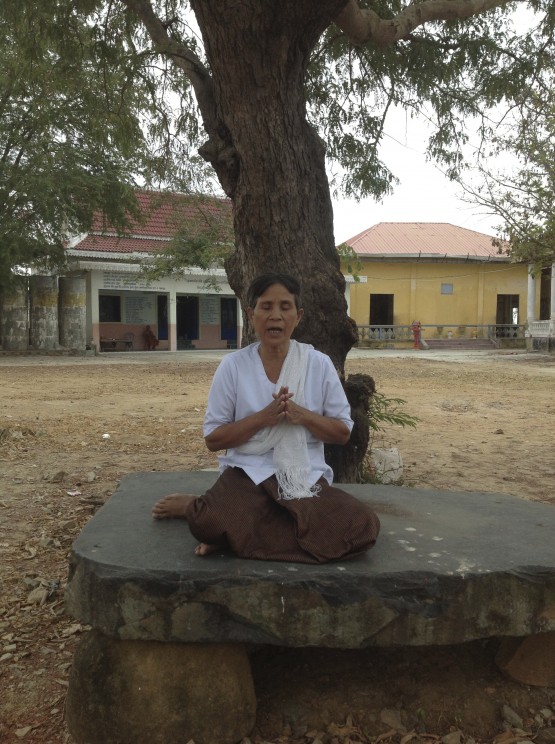Smot teacher Keot Ran chants smot on temple grounds in Kampong Speu province, Cambodia. Photo by Catherine Grant, February 2013. 