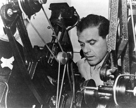 Frank Capra cuts Army film as a Signal Corps Reserve major during World War II, circa 1943. US Army. Public domain via Wikimedia Commons.