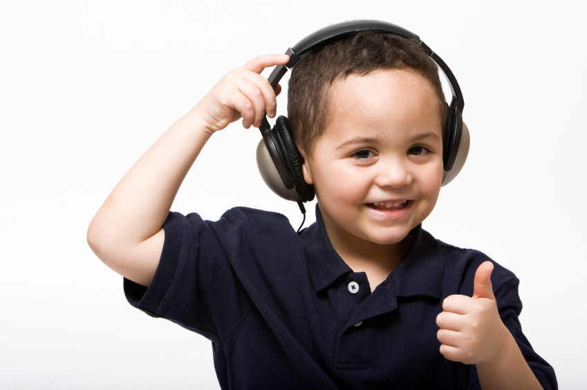Boy giving thumbs up headphones