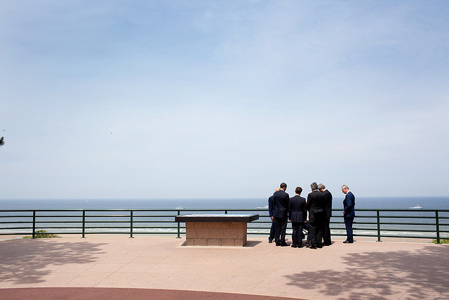 President Barack Obama marks the 65th anniversary of the D-Day invasion with veterans Clyde Combs and Ben Franklin as well as French President Nicolas Sarkozy, British Prime Minister Gordon Brown, Canadian Prime Minister Stephen Harper, and Prince Charles on 6 June 2009. Official White House photo by Pete Souza via The White House Flickr.