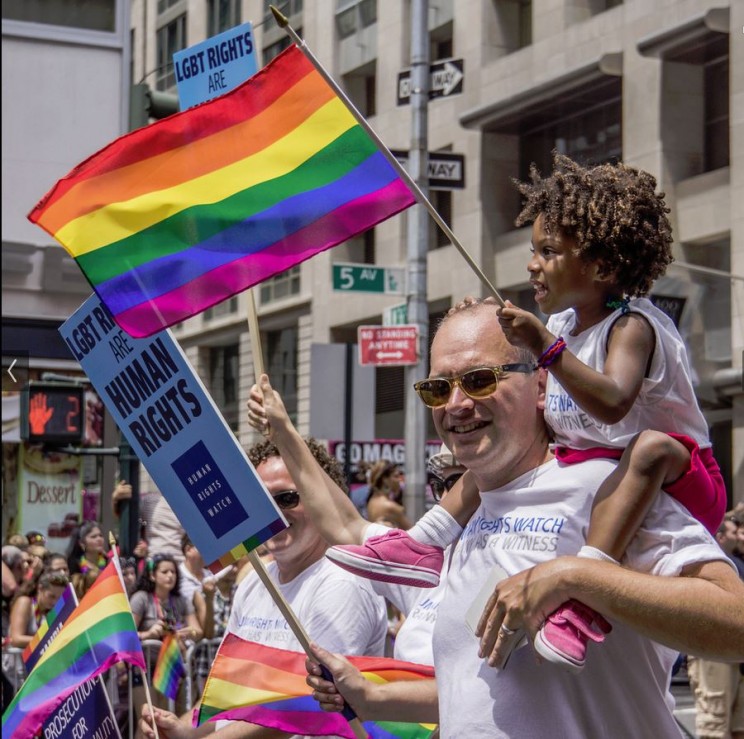 Image Credit: Gay Pride Parade NYC 2013 - Happy Family. Photo by: Bob Jagendorf. CC-BY-2.0 via Flickr.