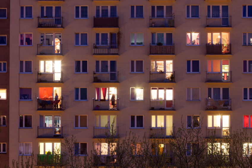 Window of an apartment block at night. © bartosz_zakrzewski  via iStockphoto.