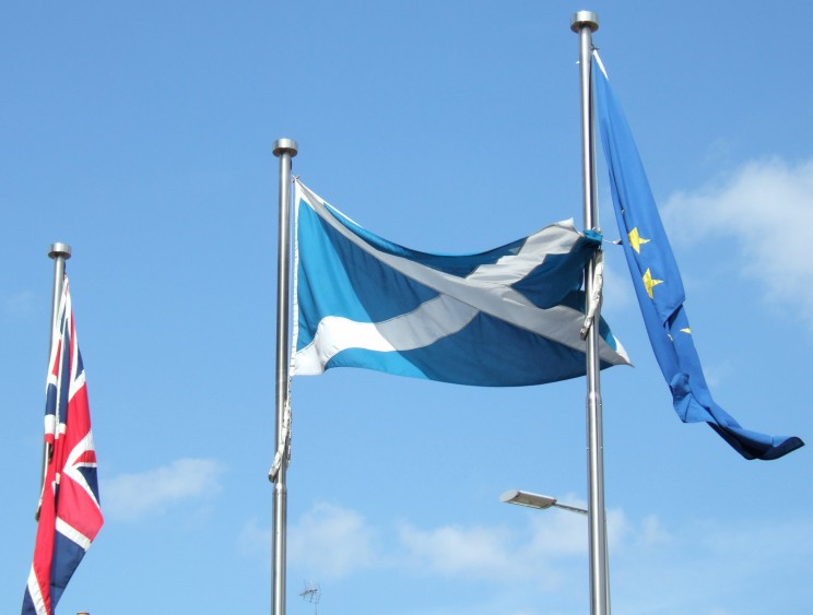 Flags outside Parliament by Calum Hutchinson. CC-BY-SA-2.5 via Wikimedia Commons.