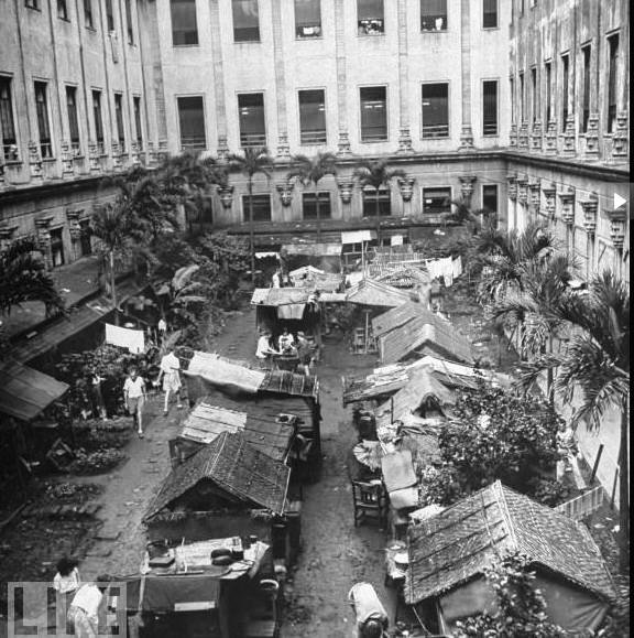 Residents in the Santo Tomas Internment Center constructed outdoor shanties to find space beyond their limited shelter.