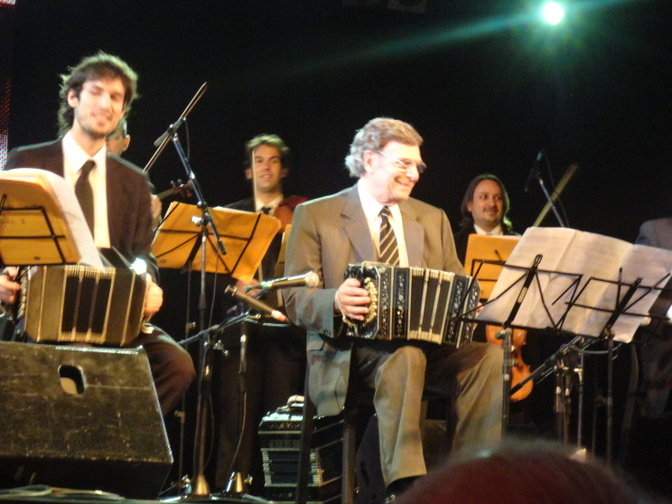 Tangueros Lautaro Greco and Leopoldo Federico (left to right) playing the bandoneón at the 2011 Tango Festival, Buenos Aires, AR, photo taken by authors.
