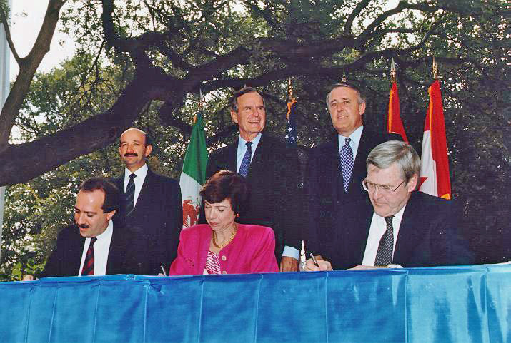 NAFTA Initialing Ceremony, October 1992 by George Bush presidential library and museum Public domain via Wikimedia Commons.