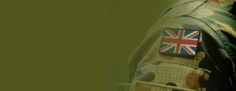 A close up of the Union Jack flag on the shoulder of a British Army soldier, fading out into an army green background to illustrate the blog post "The British Army: how is the Army meeting changing societal priorities?" by Ian F. W. Beckett on the OUP blog