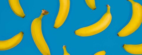 Lots of bananas on a blue background to illustrate the blog post "Building copyright: an absurdist work in progress" by Eleanora Rosati, which discusses the case of Morford v. Cattelan and the absurdist banana artworks.