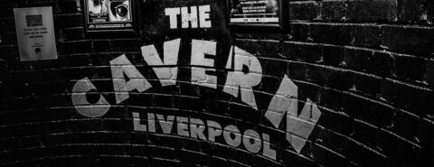 ‘The Cavern Liverpool’ logo on the brick wall inside of the Cavern Club in Liverpool, made famous by the Beatles.