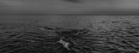 Greyscale photo of Sea Waves